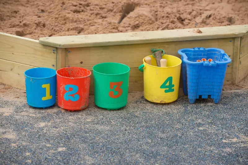 sand pit with buckets in front